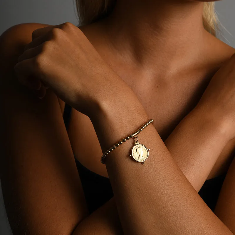 BALL BRACELET WITH THREEPENCE COMPASS COIN